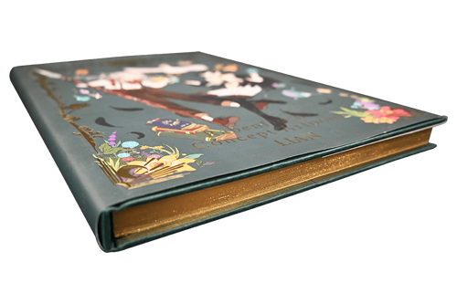 Livre d'art à couverture rigide bleue avec jaspage doré